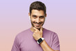 © Damir Khabirov - Portrait of handsome man in purple tshirt, showing his stylish modern smart watch with empty screen