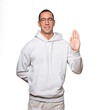 © agongallud - Happy young man making a gesture of stop with his palm