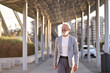 © insta_photos - Happy cool european bearded stylish old mature professional business man, smiling gray haired senior older adult businessman wearing suit walking going outdoors in big city on sunny day.