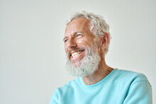 Smiling Bearded Mature Older Fashion Gray-haired Hipster Man, Happy Old Senior Male Model Having Fun Feeling Cheerful Looking Away Laughing Standing Isolated At White Wall. Close Up Headshot