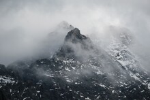 Dramatic Scenery Of Rocky Mountain Peaks In Clouds. Rysy And Niznie Rysy In The High Tatras. Carpathians, Poland