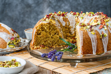 Sticker - Fragrant Persian love cake decorated with with vanilla icing, crushed pistachio nuts and dried rose petals