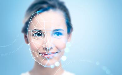 Smiling attractive businesswoman with facial recognition by digi