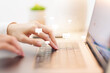 © Felizlalala - Closeup of woman hands typing text on keyboard laptop. Online live chat chatting on application communication digital media website and social network