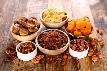 Wall Mural - assorted of dried fruits on wood background