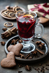 Wall Mural - Glass with mulled wine and spices, selective focus