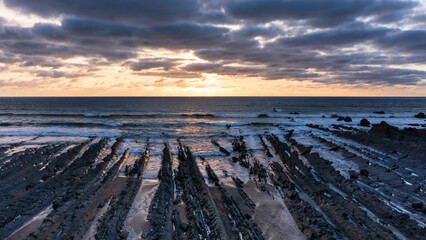 Wall Mural - Gorgeous vibrant aerial drone landscape sunset image of Welcombe Mouth Beach in Devon England