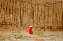 Women And Landscape Of Soil Textures Eroded Sandstone Pillars, Columns And Cliffs, Natural Erosion Of Water And Wind, Sao Din Na Noi, Hom Chom, Khok Suea At Sri Nan National Park In Nan Province.