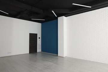 Wall Mural - Empty office room with black ceiling and door. Interior design