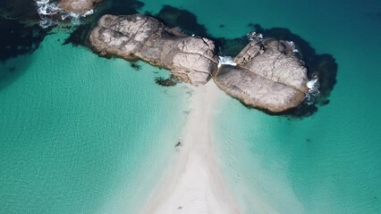 Wall Mural - Aerial video of 2 people walking along the beach in Wylie bay, Esperance, Western Australia. 2 beaches next to each other. Blue and shallow water. Very beautiful and calm landscape. 