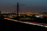 Fototapeta Miasto - sunset on the new bridge in the city