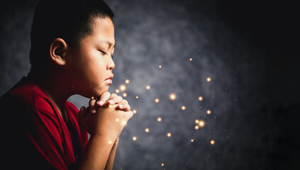 Wall Mural - Christianity religion concept. Christian life crisis prayer to god. Young boy pray for god blessing to wishing have better life. Hand worship to god. Begging for forgiveness and believe in goodness.
