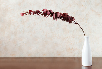 Canvas Print - vase and flowers on a wooden table on a light background. Interior detail. Minimalism.	