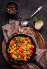 Wall Mural - Cooked bell peppers of different colors, healthy vegetable dish