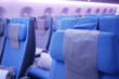 © Towfiqu Barbhuiya  - purple color Empty passenger airplane seats in the cabin