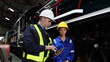 © FotoArtist - Group of apprentices with instructor at railway engineering facility. Teacher talking to apprentices at railway engineering facility