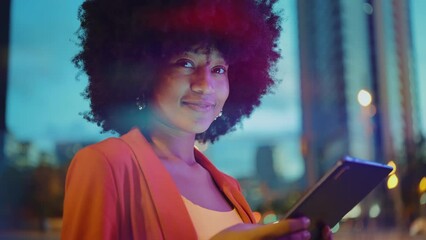 cinematic video of a self confident young woman spending time in a modern city. millennial girl with
