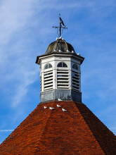 Roof Of A Dovecote With White Doves