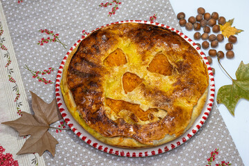 Pumpkin pie with cinnamon, baked at home, on a plate