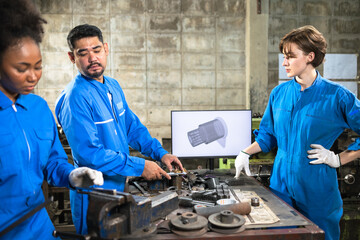 Wall Mural - Engineer senior asian man and african woman wearing safety helmet working and checking machine  automotive part warehouse. Factory for the manufacture and processing.