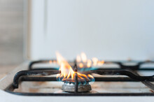 Burning Gas In The Kitchen. Horizontal Photo With Space For Writing Text.