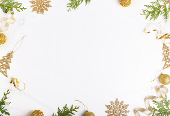 Christmas decorations in gold colors on white background. Gift, holiday and celebration concept, top view