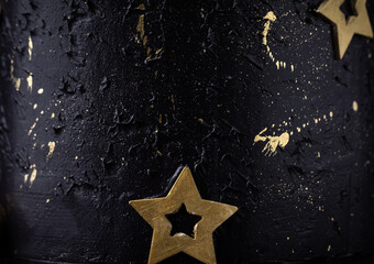 Canvas Print - Texture of dark blue cream cheese frosting decorated with golden chocolate stars . Birthday space themed cake as a textured background. Macro shot