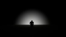 Depressed Silhouette Of A Man Sitting In The Dark
