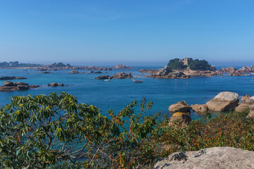 Entrance of port of Ploumanac'h on a sunny summer day with islands and Chateau de Coastares, Cote de Granit Rose Brittany , France