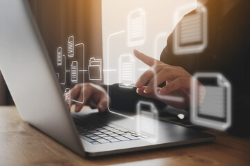 Businessman using computer laptop on desk. Document management system (DMS), online documentation database and process automation to efficiently manage files