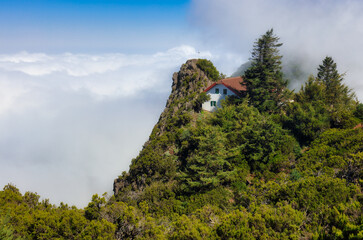 Wall Mural - Madeira island - Casa de Abrigo near Pico Ruivo over clouds