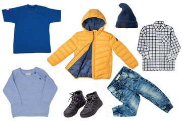 Collage set of little boys autumn clothes isolated on a white background. Denim trousers or pants, boots, a rain jacket, shirts and a cap for child boy. Children's spring fashion.