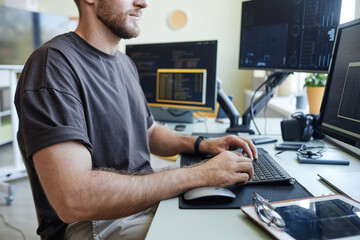 side view cropped shot of software developer writing code in office, copy space