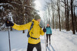 © Halfpoint - Senior couple skiing together in the middle of forest