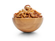 A snack bowl of salted savoury party food, crispy nibbles isolated against a transparent background viewed from the side.