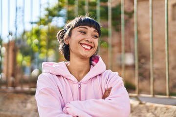 Sticker - Young woman smiling confident standing with arms crossed gesture at street