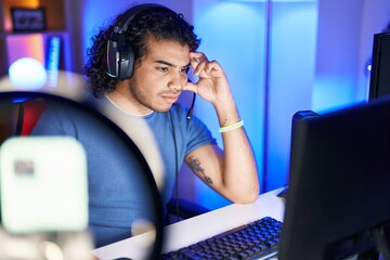 Sticker - Young latin man streamer stressed using computer at gaming room