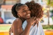 © Krakenimages.com - African american women mother and daughter hugging each other at park