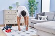 © Krakenimages.com - Young hispanic man stretching at home