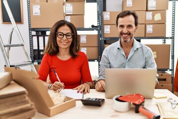 Sticker - Middle age couple working at small business ecommerce with a happy and cool smile on face. lucky person.