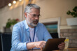 © zinkevych - Gray-haired mid aged man with a laptop