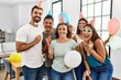 © Krakenimages.com - Group of young hispanic friends having birthday party smiling happy and looking to the camera at home.