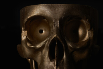 Wall Mural - Gold human Skull Isolated on black background