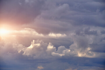 Wall Mural - Breaking sunlight through gap of storm clouds.