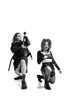 © Lustre Art Group  - Portrait of young man, guitar player and woman, rock and roll musicians performing over white background. Black and white photography