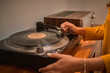 © ADDICTIVE STOCK - Crop person playing music on vintage record player