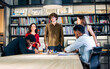 © Ann Rodchua - Group of diverse and multiracial businesspeople wearing casual clothes for work, meeting and brainstorming about project and marketing plan in modern indoor meeting room at office. Business Concept.