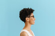 © Drobot Dean - Black young woman in eyeglasses looking aside and smiling
