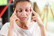 Distressed tired woman touch temples, suffer huge migraine