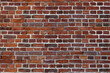 Old wall red briks tiled background, regular block texture. Wallpaper terracotta rustic wall surface